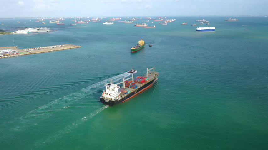 Drone Aerial view 4k Footage of International Containers Cargos ship,Freight Transportation, Shipping,Trade Port,Shipping cargo to harbor, Royalty-Free Stock Footage #1059930104