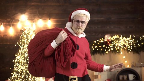 Santa Claus dancing with bag of gifts. Delivery christmas gifts. Positive human facial expressions and emotions