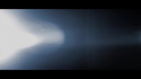 Glowing lens flare effect with floating dust particles from the Radium Collection - Lens Flare Video Element - Powered by Shutterstock - Get 15% off with code: PIKWIZARD15