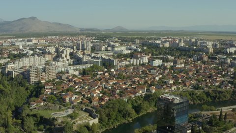 Podgorica, Montenegro - August, 2020: aerial view of Podgorica capital city of Montenegro. Drone shot on a panorama of the city where you can see the river bridges and the old city.