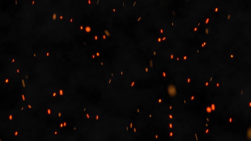 Closeup of burning hot bonfire fire sparks. Fire Particles over black background with smoke. Flying Embers from fire