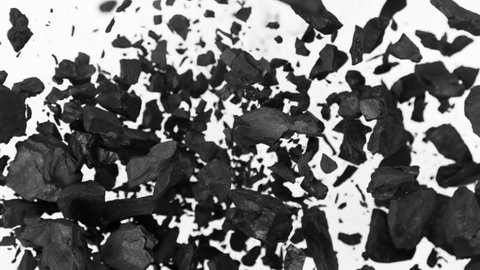Super Slow Motion Shot of Coal Explosion Isolated on White Background at 1000 fps.