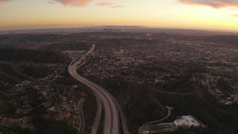 Cinematic aerial flyover of highway traffic in Glendale, California