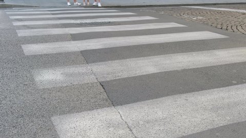 young girls cross on the zebra crossing
