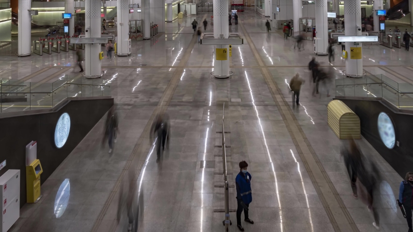 Movement of people on escalators at the entrance and exit from the subway, time lapse