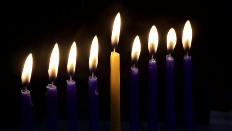 Hebrew Menorah of Hanukkah with burning candles is traditional symbol for Jewish holiday
