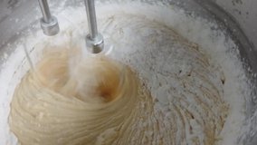 Chef is mixing ingredients with electric mixer in bowl. Preparing delicious cream to make cake. Out of focus.  - Powered by Shutterstock - Get 15% off with code: PIKWIZARD15