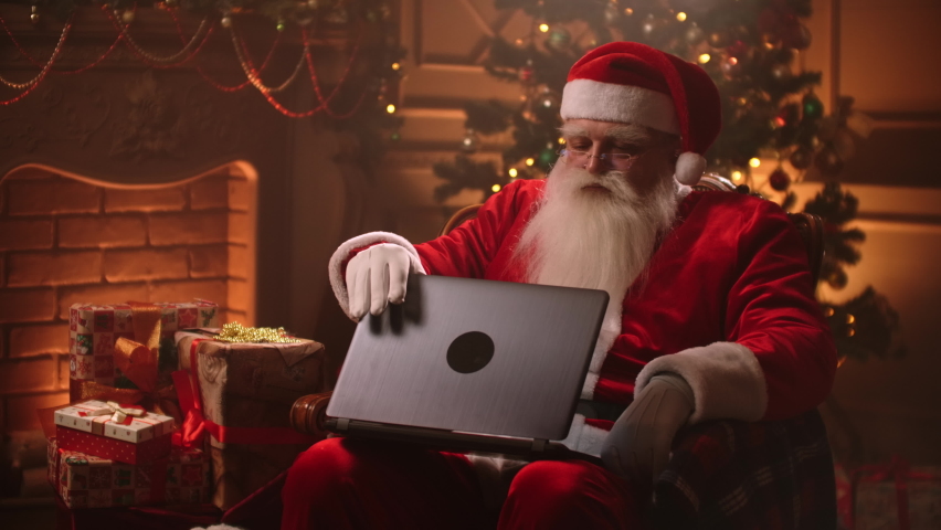 Santa Claus shopping on computer. Christmas sale time | Shutterstock HD Video #1059957194