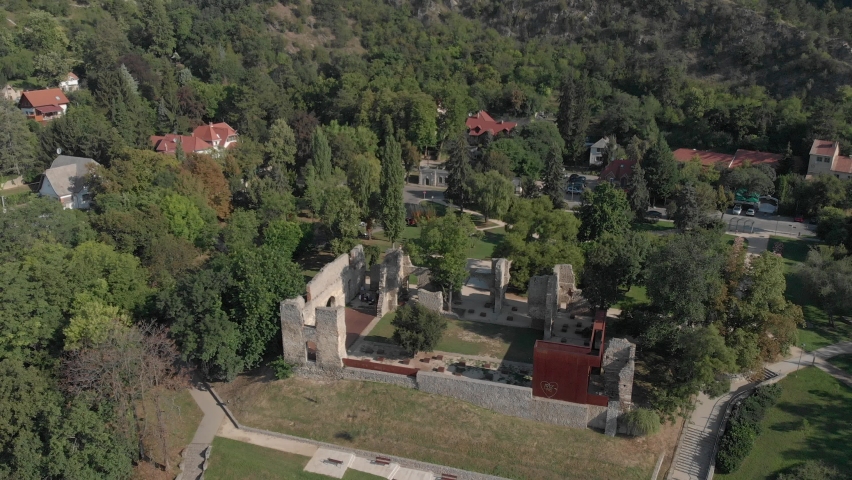Aerial / drone footage of Tettye Park in Pécs, the fifth largest city of Hungary, cultural center of Hungary, on the slopes of the Mecsek mountains, economic center of Baranya County