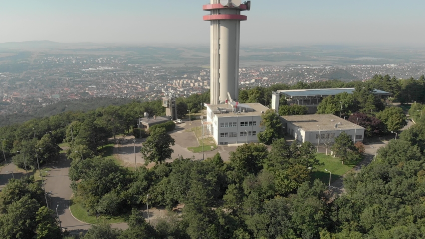 Aerial / drone footage of Pécs TV Tower. Pécs is the fifth largest city of Hungary, a major cultural center of Hungary, on the slopes of the Mecsek mountains in Baranya County