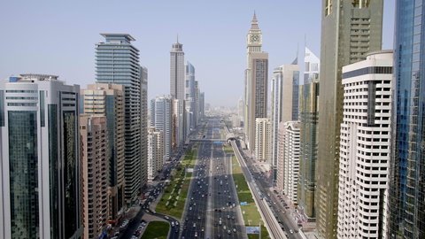The marvelous aerial architectural wonder of the busiest highway in the world the Shaik Zayed Road along with the towering skyscaper, 6-axis stabilized gimbal, Shotover F1, 8K, parallax.