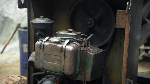 a petrol generator powering a concrete mixer.
