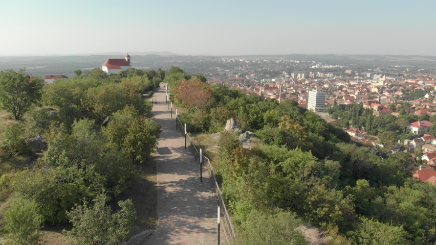 Aerial / drone footage of Tettye Park in Pécs, the fifth largest city of Hungary, a major cultural center of Hungary, on the slopes of the Mecsek mountains, economic center of Baranya County