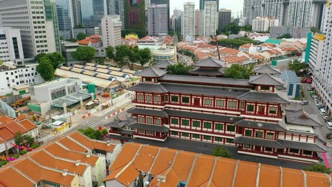 Drone Aerial view 4k Footage Of Chinatown Skyline in the Morning Showing a Mix of Traditional Shophouses and Modern Buildings. Buddha Tooth Relic Temple in Singapore.