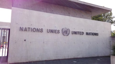 Geneva, Switzerland - Aug 16, 2020: signboard with Emblem at entrance of United Nations HQ or Palais des Nations in Ariana Park, by the lake Geneva. Since 1966 is the main European headquarters of UN.