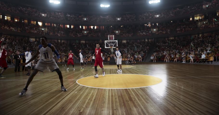 Basketball player scores a goal on a professional basketball stadium. Stadium is made in 3d with animated crowd. Dynamic shot. | Shutterstock HD Video #1059978974