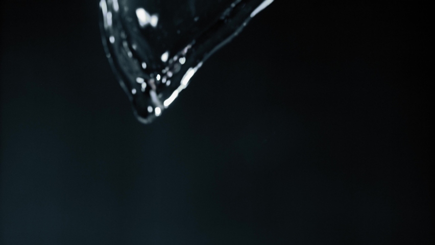 Pouring clear fresh water - slow motion close up