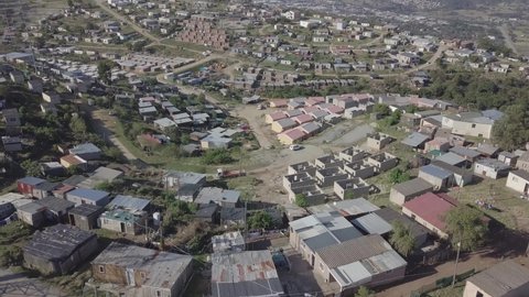 Aerial: New home construction in Xolweni Township above Knysna, Africa