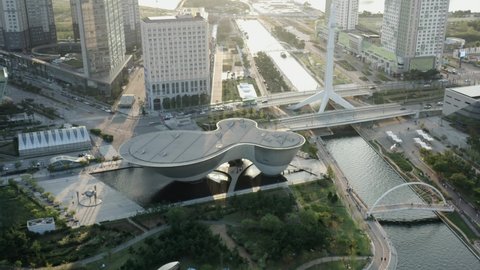 Aerial Parallax of Songdo Central Park in Songdo City, South Korea During Golden Hour