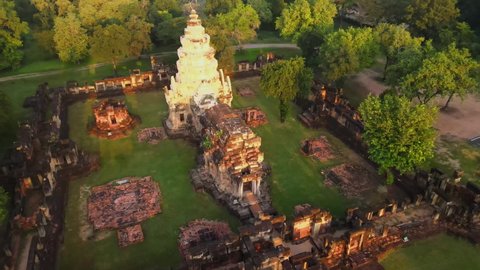 Drone footage of ruins of an ancient Asian temple in Thailand at sunrise.