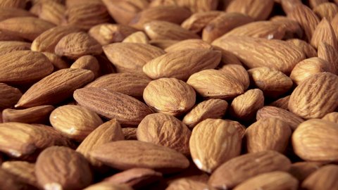 A rotating shot of almonds. The product is rich in minerals and vitamins. Texture of Almond kernels. Close up