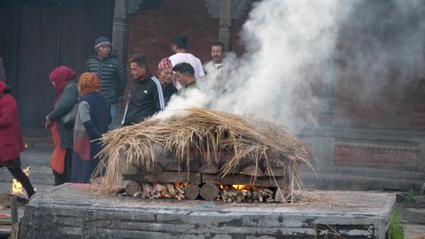 Pashupatinath, Kathmandu, Nepal. 12-15-2019. Body being cremated at Pashupatinath temple ghats.