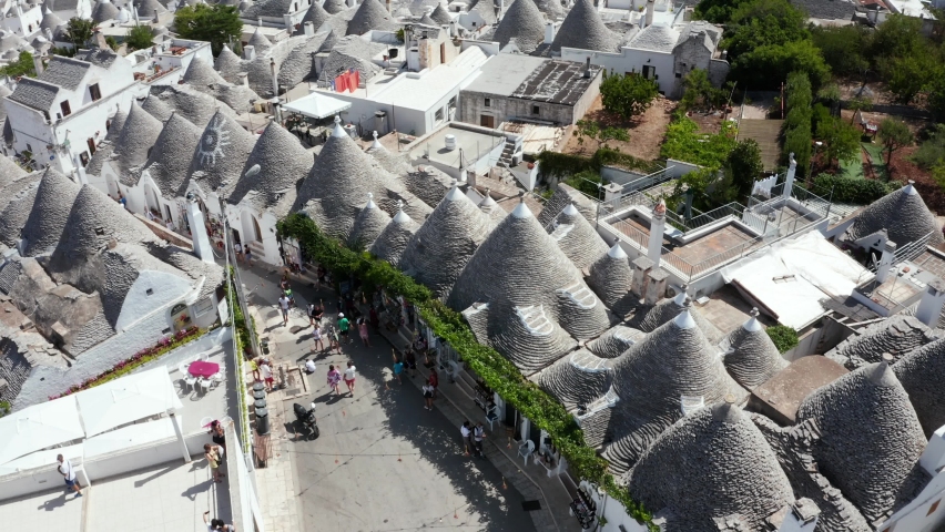 Beautiful aerial view of the traditional trulli houses in Alberobello, province Bari, region Puglia, Italy Royalty-Free Stock Footage #1059995627