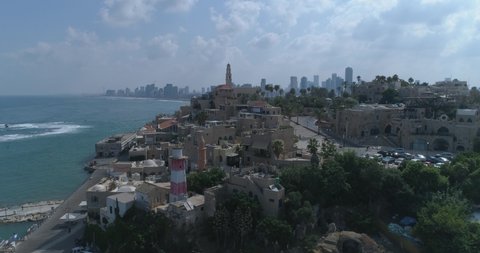 Tel Aviv - Jaffa. Aerial Drone footage. Fly from saint peter's church in Jaffa to Tel Aviv beaches and Skyline cityscape
