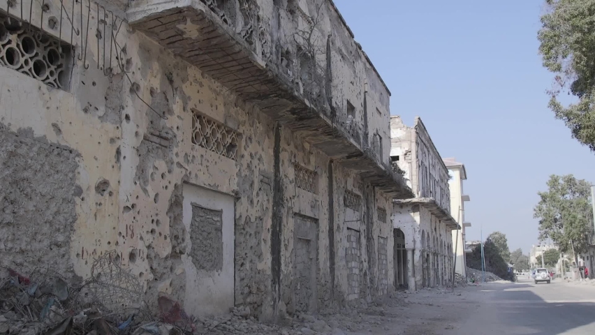 street view of an old bombed building.