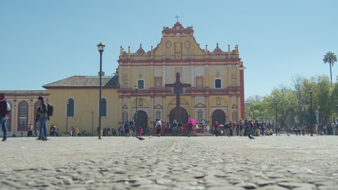 San Cristóbal de las Casas, Chiapas/Mexico - February 26 2020: lots of mexican people walking on the street in the morning with San Cristobal's Cathedral on the background