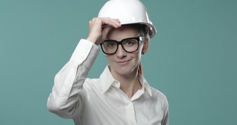 Business people wearing a safety helmet, protection and workplace safety concept, video montage