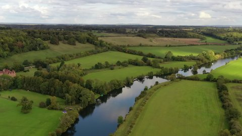 4k aerial above a meander on The River Thames near Reading, Berkshire, UK