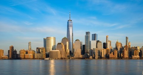 New York City - USA - Feb 17 2020: Day to Night Timelapse Sunset Clouds Moving Over Buildings in Lower Manhattan Financial District Hudson River Video de stock