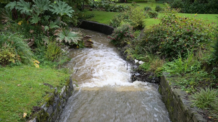 water damage from flood water running through garden
