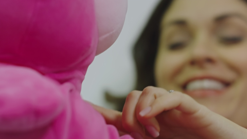 Close-up of pregnant woman playing with stuffed animal toy Royalty-Free Stock Footage #1060064861