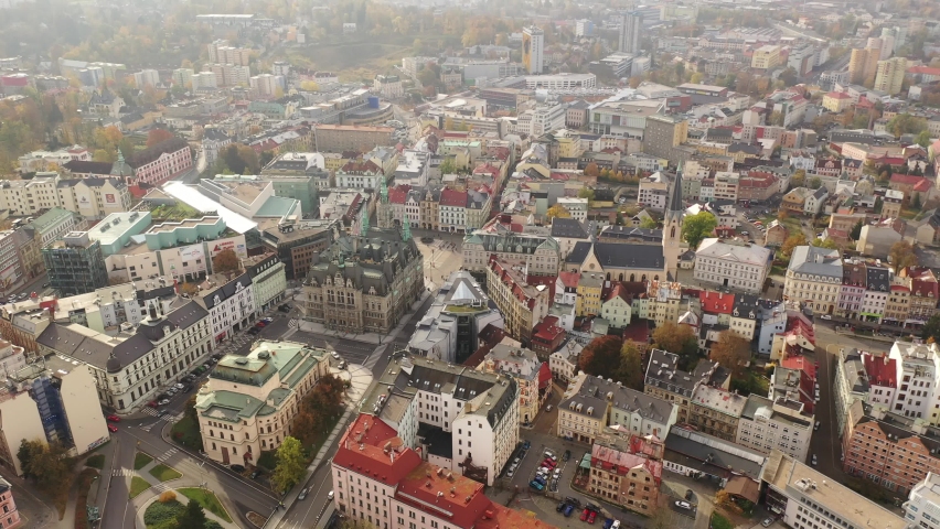 Aerial view of residential districts of Liberec city and grandiose building of Town Hall in autumn day, Czech Republic