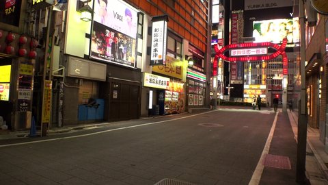 TOKYO, JAPAN -28 APRIL 2020 : View around Shinjuku Kabukicho area. Tokyo governor called refrain from going outside, due to concerns over Coronavirus. Street is normally busy, but lightly populated.