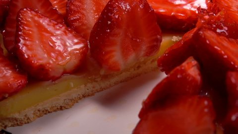 A super close-up of a strawberry pie with delicious strawberry slices