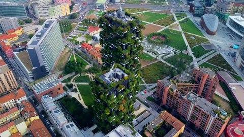 Aerial view of ecological skyscrapers with many trees on each balcony. Bosco Verticale. Modern architecture, vertical gardens, terraces with plants. Ecology. Green Planet. Milan. Italy, 01/10/2020: