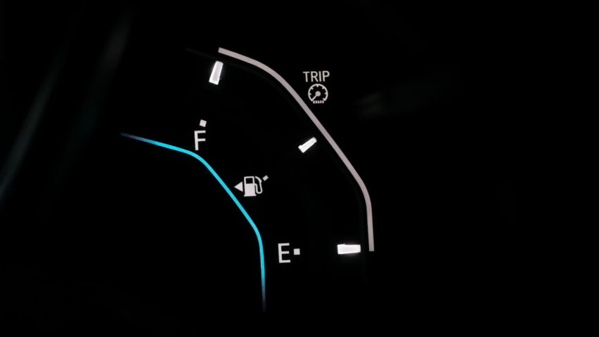 Fuel gauge car dashboard show fuel empty to full. Blue light moving up to full when tank is fuel full. Close up gasoline meter on black background. Full tank of gas for long distance drive concept. | Shutterstock HD Video #1060094789