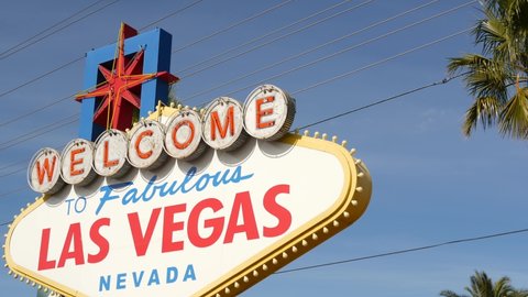 Welcome to fabulous Las Vegas retro neon sign in gambling tourist resort, USA. Iconic vintage banner as symbol of casino, games of chance, money playing and hazard betting. Lettering on signboard.