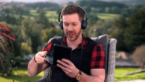 Young Man Has Video Call On Tablet From Garden Outside, 4K.