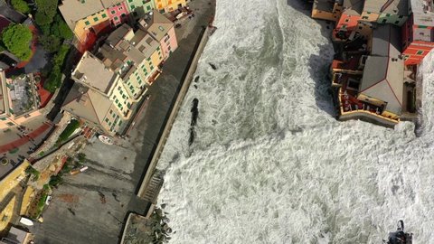 the rough sea breaks on the coast of Boccadasse, Genoa, Liguria, Italy. Vista aerea realizzata con drone
