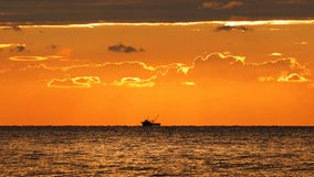 Sailing yacht and golden sea sunrise