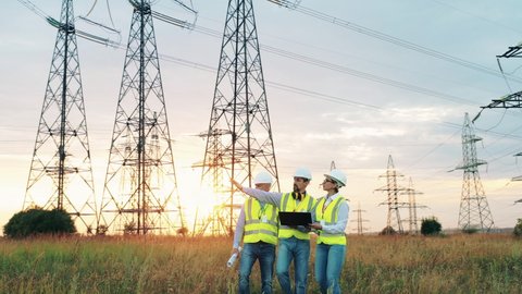 Engineers check power grids. Electric industry, electrical energy production concept.