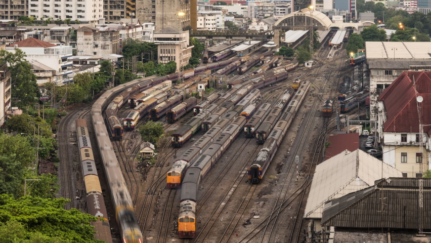 Time-lapse of old trains parking in rail yard at Hua Lamphong train station in Bangkok city, Thailand. Railway transportation concept. High angle view Royalty-Free Stock Footage #1060111739