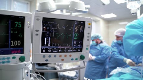 Patient's condition on the health monitor. Medical computers in the intensive care unit show normal vital signs. Critical care concept.