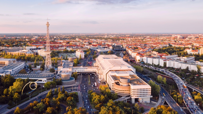 Golden Hour Aerial View Hyper Lapse of Berlin cityscape with radio tower and highway traffic, Berlin, Germany