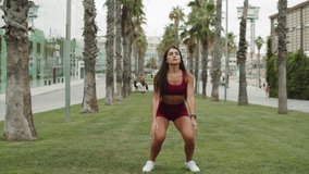 Sport woman stretching leg muscle after running workout, fitness trainer preparing for jogging, student trainer exercising in city center park in barcelona, spain