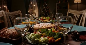 Close up shot of family celebration dinner table served with healthy vegetarian meals. holiday party table during thanksgiving or christmas - food and drink concept 4k footage
